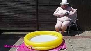 Mature With Massive Tits In The Smallest Bikini By The Pool